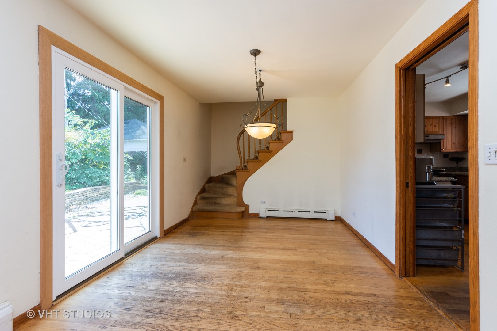 403 North Plum Grove Road Palatine, IL 60067 - Photo 5 of 11 a view of a livingroom with wooden floor and stairs