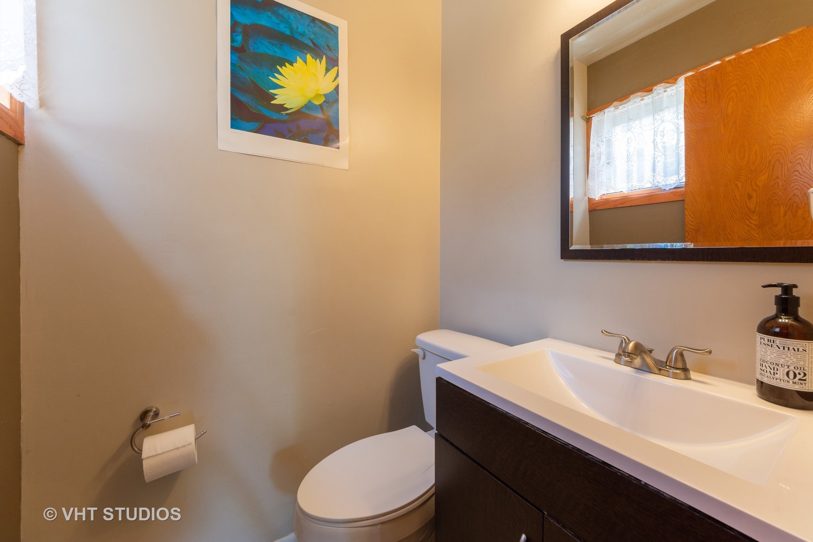 403 North Plum Grove Road Palatine, IL 60067 - Photo 9 of 11 a bathroom with a sink a toilet and mirror
