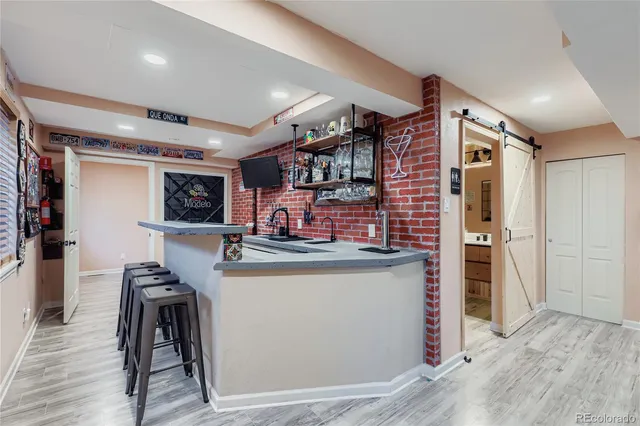 a kitchen with stainless steel appliances granite countertop a stove and a refrigerator