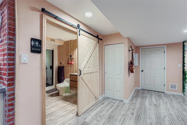 a view of entryway with wooden floor and stairs