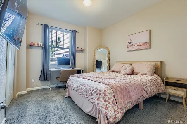 a bedroom with bed and a window