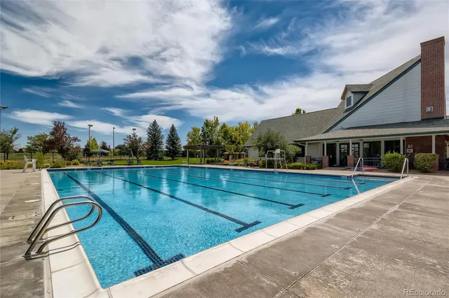 a view of swimming pool with outdoor seating