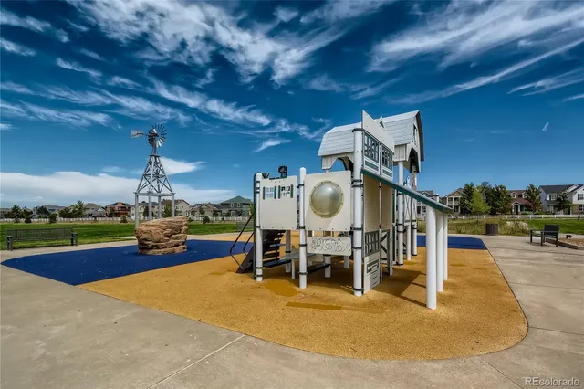 a view of a swimming pool with seating area and furniture