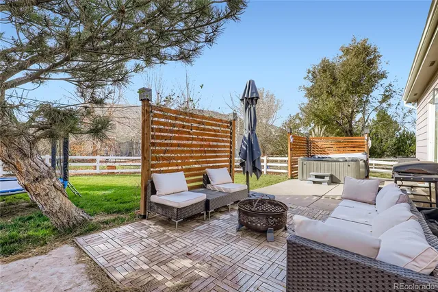 a view of a patio with couches and a fire pit