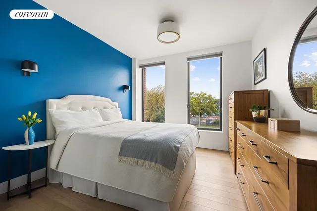 a bedroom with a bed and a dresser