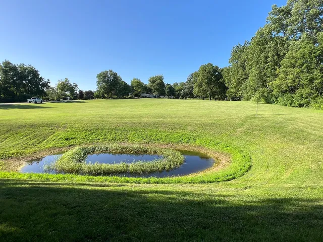 a view of a lake with a big yard