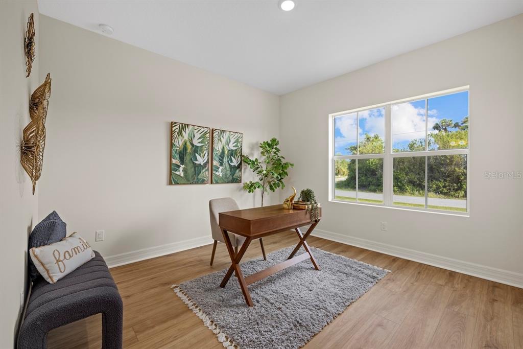 5670 Gilroy Avenue North Port, FL 34288 - Photo 13 of 28 a living room with furniture and a window