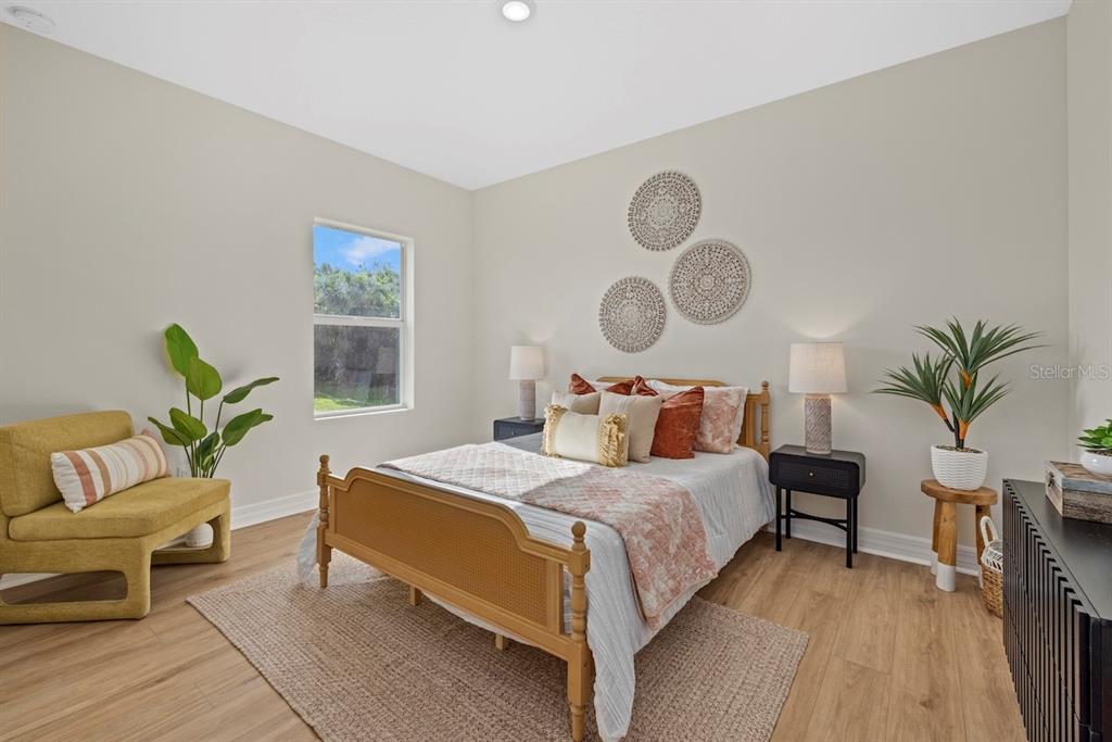 5670 Gilroy Avenue North Port, FL 34288 - Photo 25 of 28 a bedroom with a bed and window