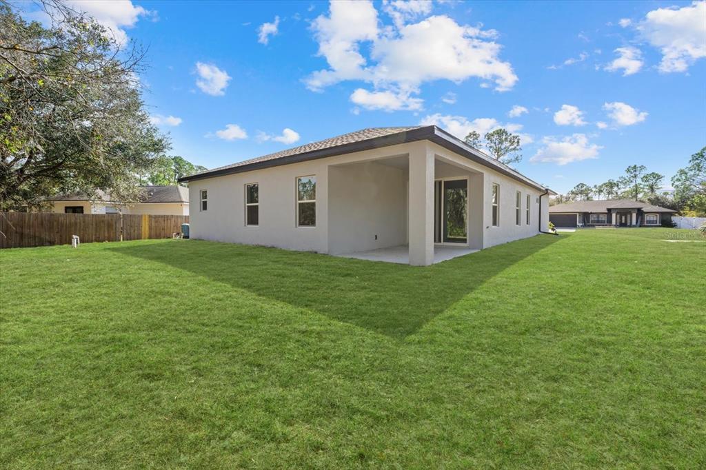 5670 Gilroy Avenue North Port, FL 34288 - Photo 7 of 28 a view of a house with a yard