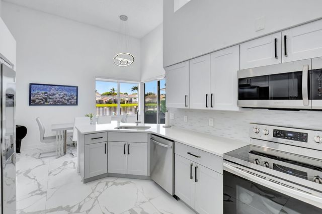 a kitchen with a stove and a microwave