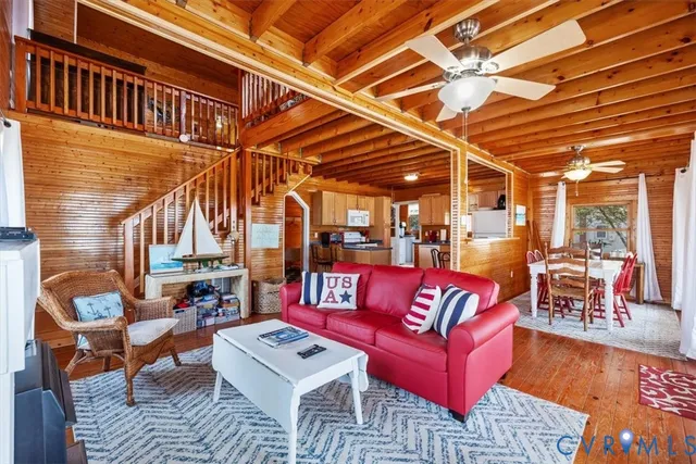 a roof deck with couch and chairs