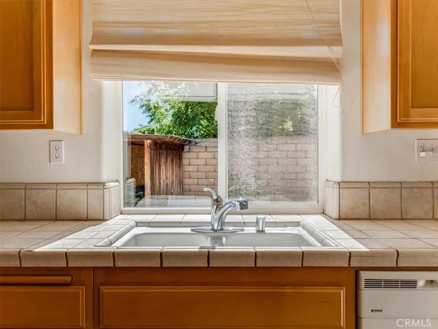 a kitchen with a sink and a window