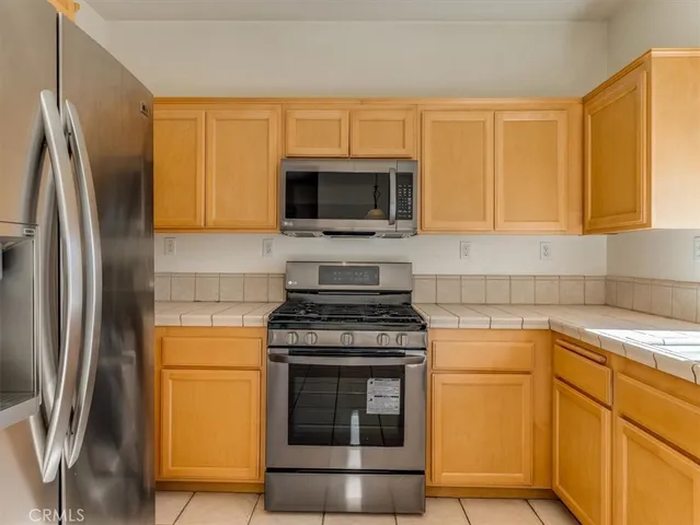 a kitchen with a stove microwave and sink