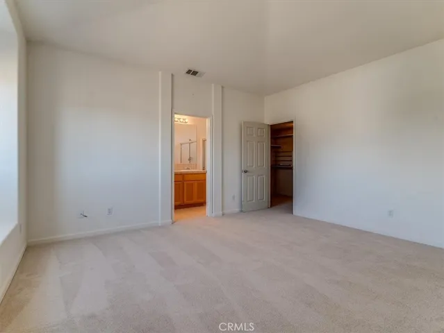 an empty room with an entrance and door