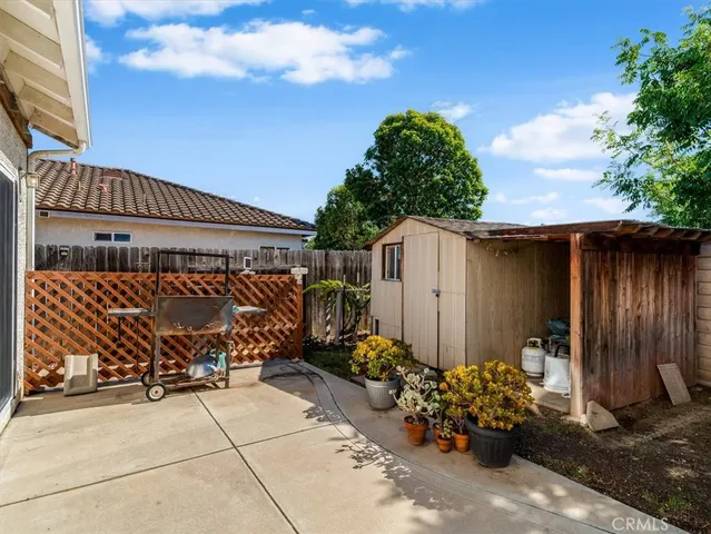 a view of a house with potted plants