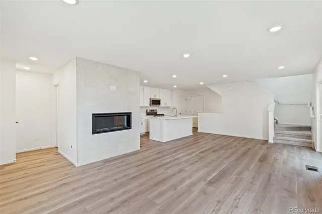 a view of kitchen with wooden floor