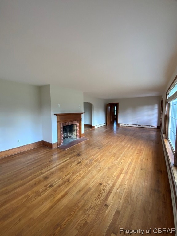 14 Light Street Heathsville, VA 22473 - Photo 5 of 18 Unfurnished living room featuring a fireplace and dark hardwood / wood-style floors
