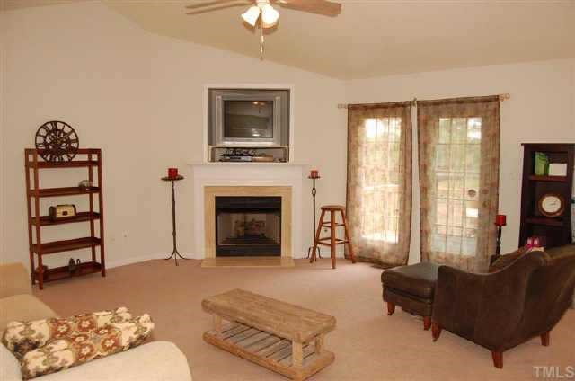The family room is perfect for relaxing or entertaining.  The cathedral ceiling provides an open and roomy feeling.