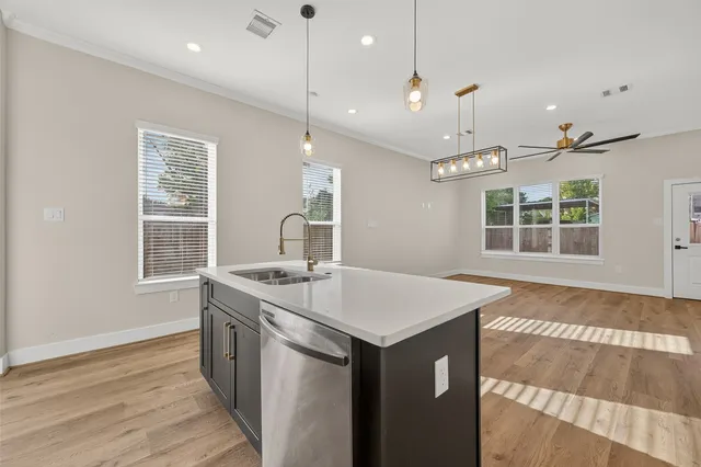 a kitchen with granite countertop a stove and a microwave