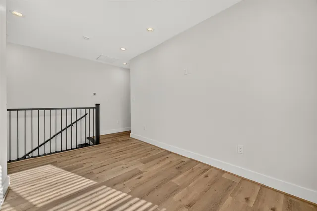 a view of livingroom with hardwood floor and hallway