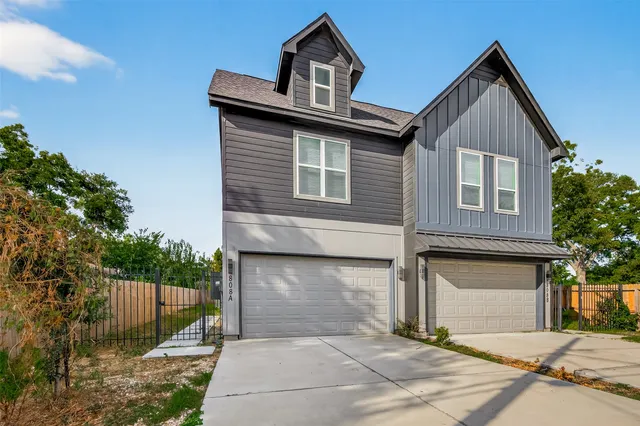 a front view of a house with a garage