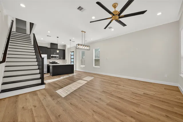 a view of a kitchen with stairs and ventilation
