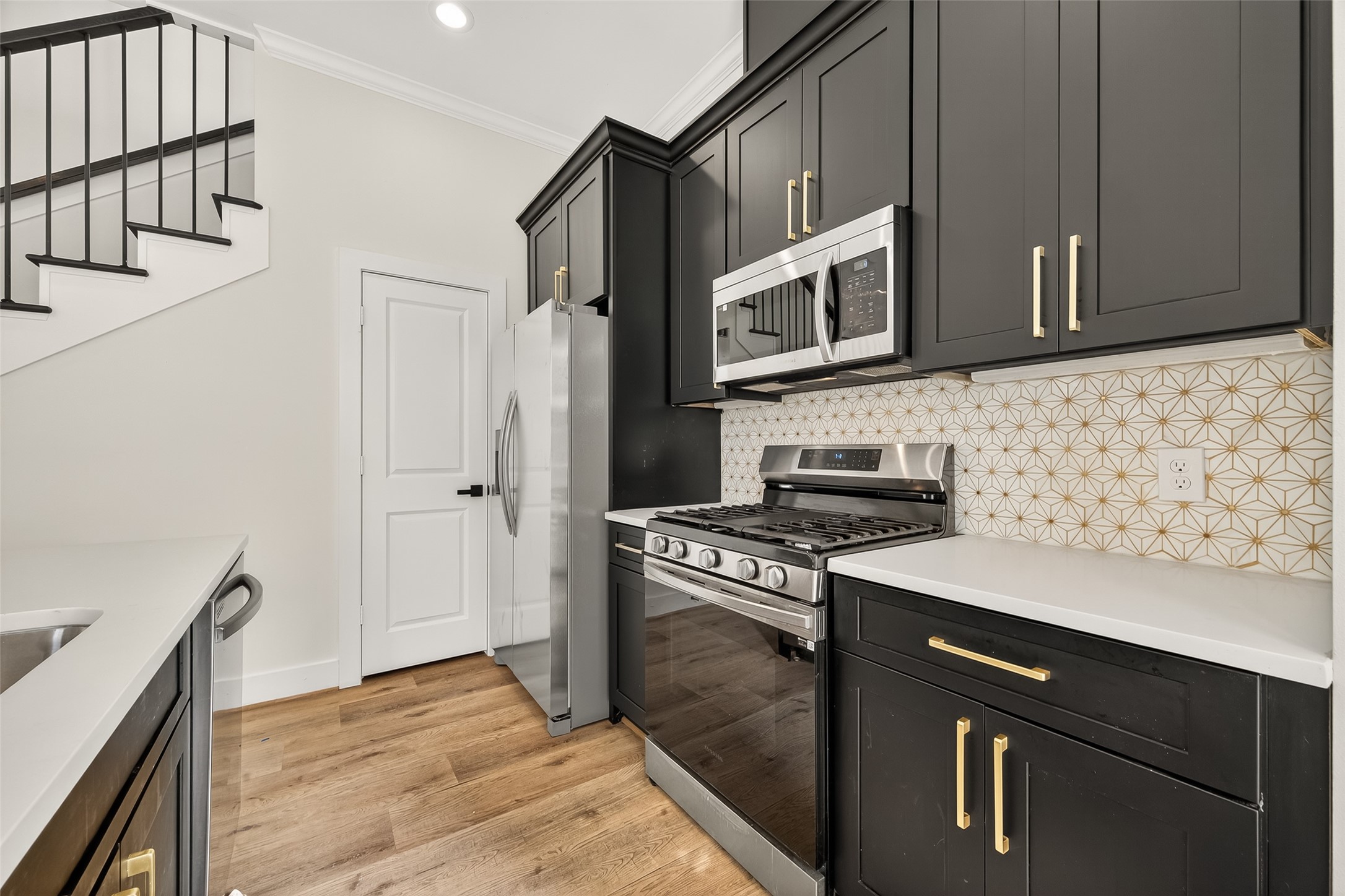 808 Fortune Street, Unit A Houston, TX 77088 - Photo 9 of 38 Wel appointed kitchen with granite countertops, tile backsplash and stainless steel appliances