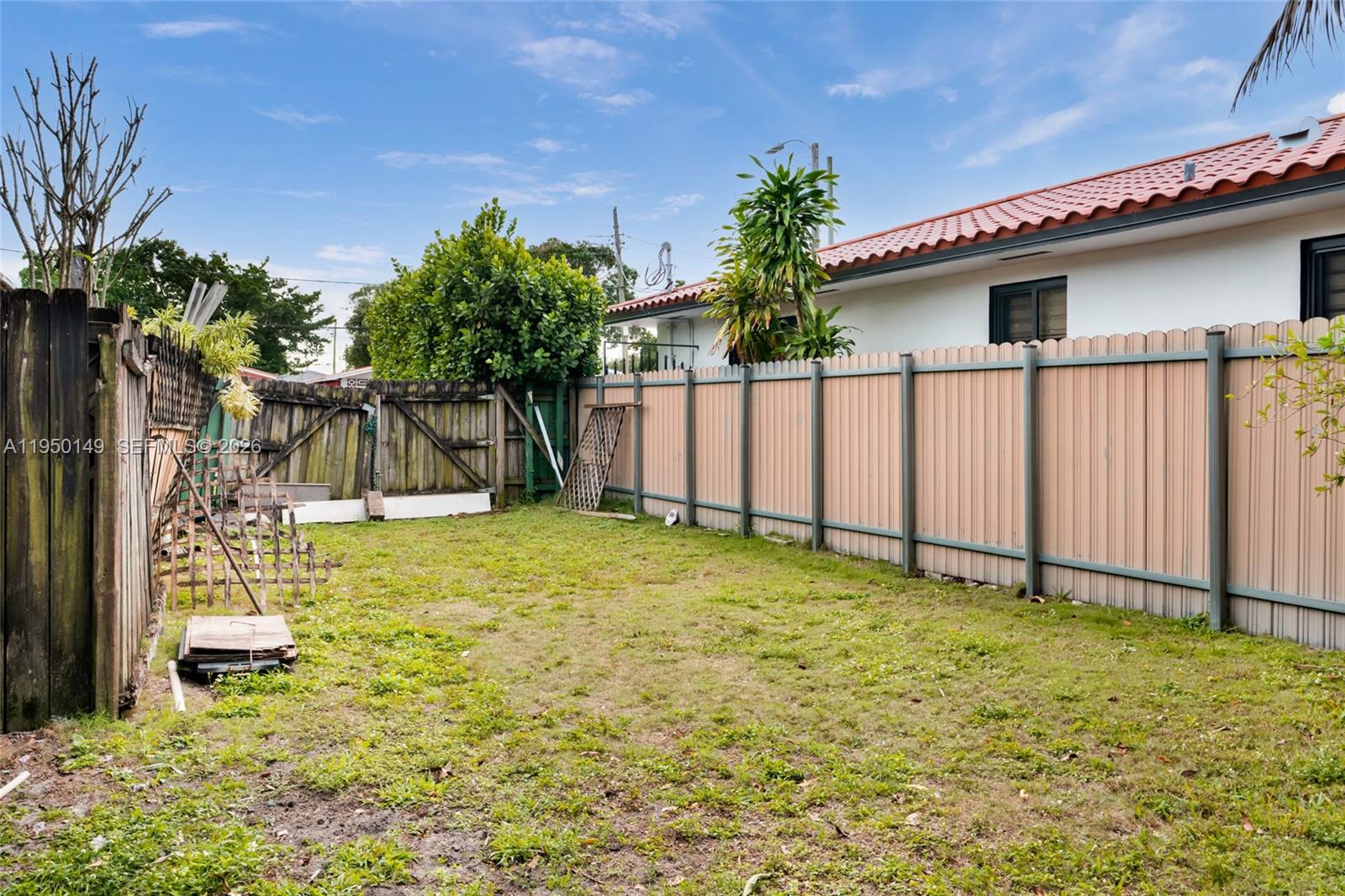 5955 Southwest 4th Street Miami, FL 33144 - Photo 17 of 18 a house with garden in front of it