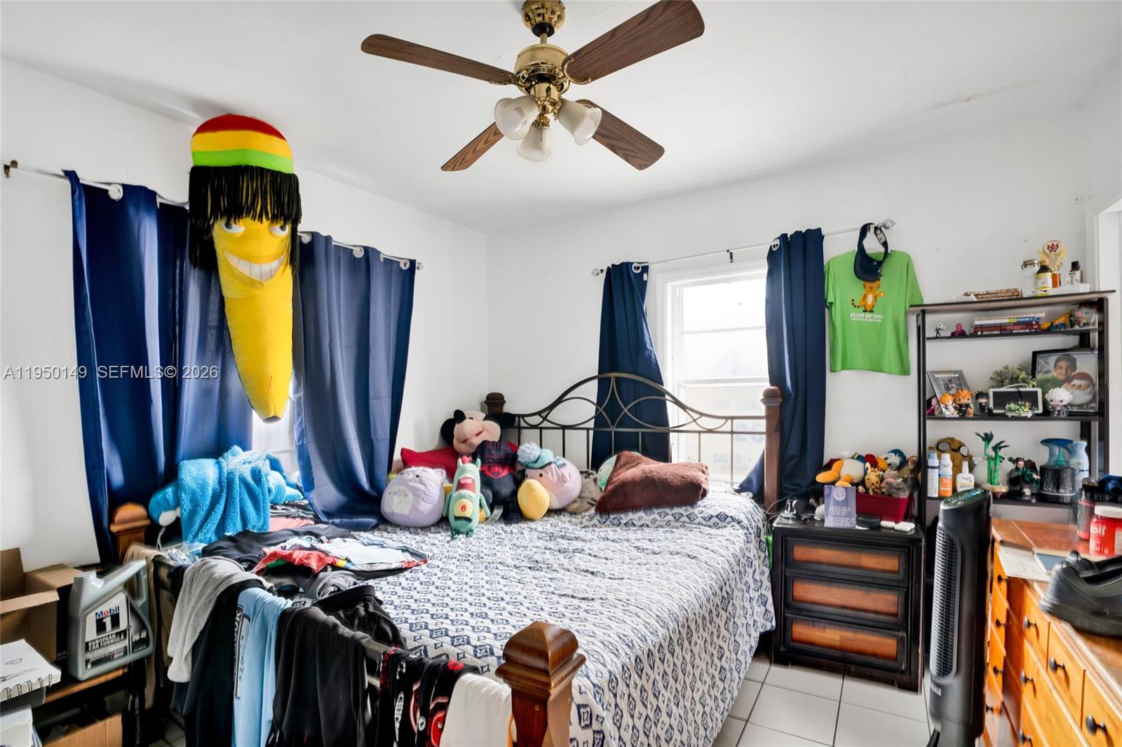 5955 Southwest 4th Street Miami, FL 33144 - Photo 8 of 18 a bedroom with a bed dresser and a mirror