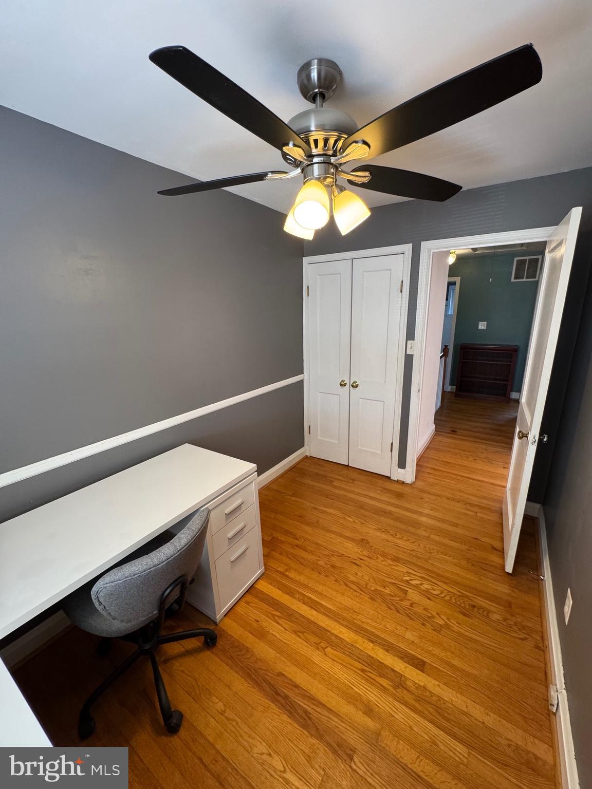 1052 Downton Road Baltimore, MD 21227 - Photo 27 of 55 a bedroom with a bed and a chandelier