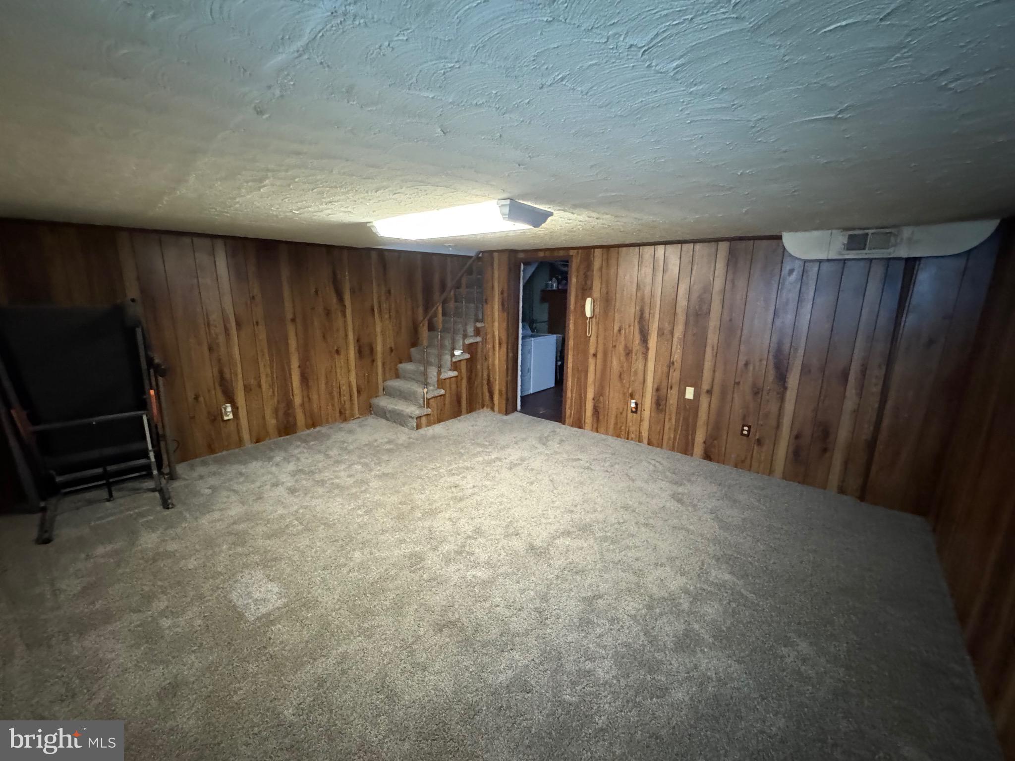 1052 Downton Road Baltimore, MD 21227 - Photo 31 of 55 a view of an empty room with furniture and a window