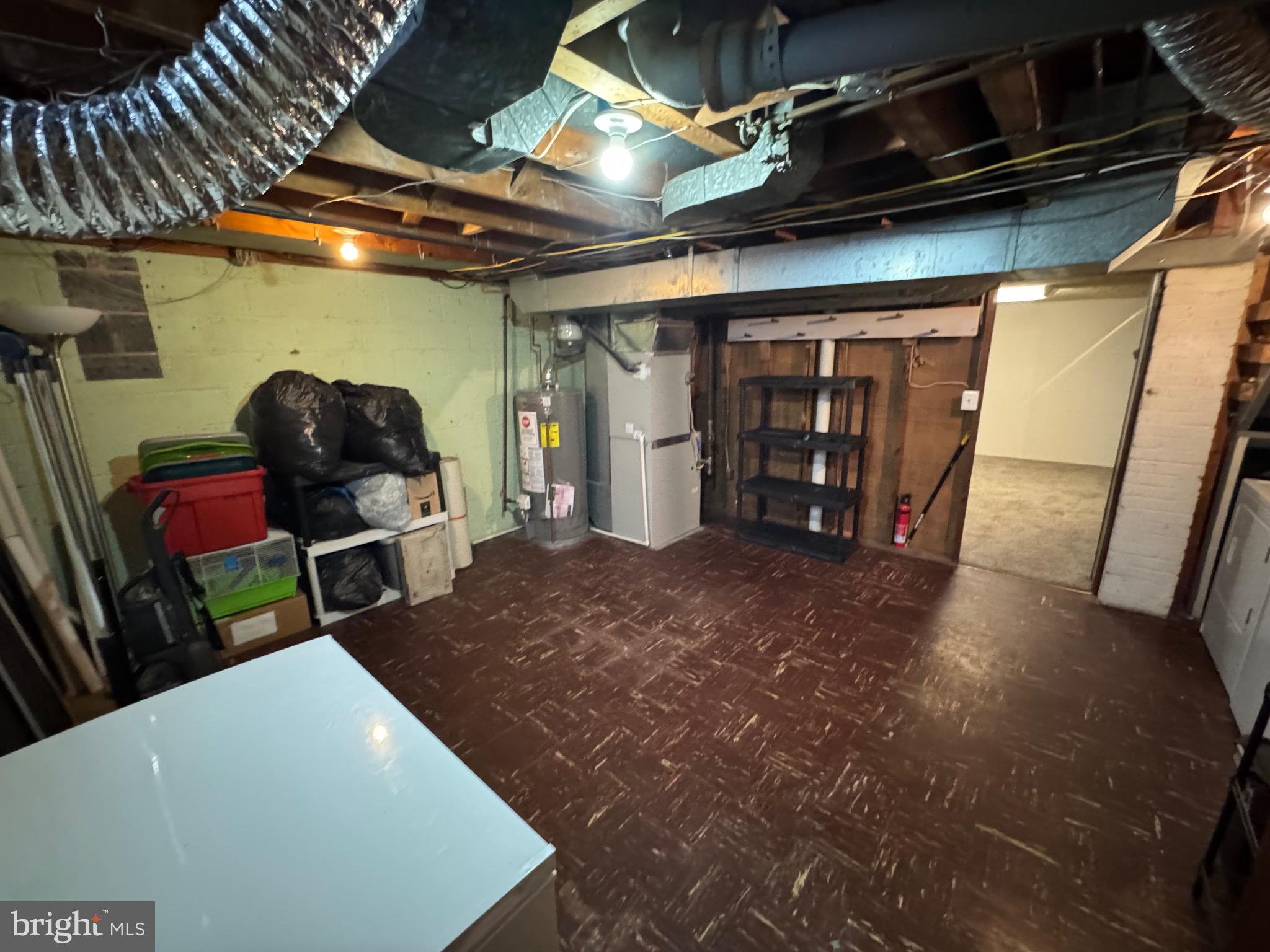 1052 Downton Road Baltimore, MD 21227 - Photo 34 of 55 a view of an empty room with wooden floor