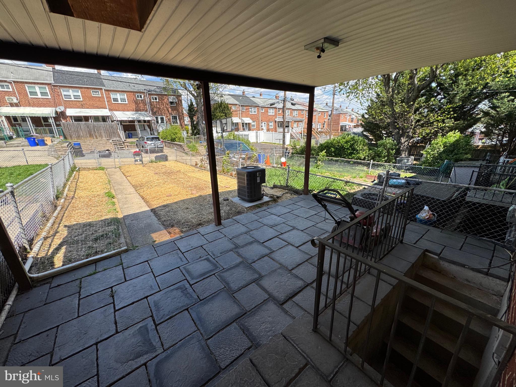 1052 Downton Road Baltimore, MD 21227 - Photo 37 of 55 a view of a swimming pool with a patio