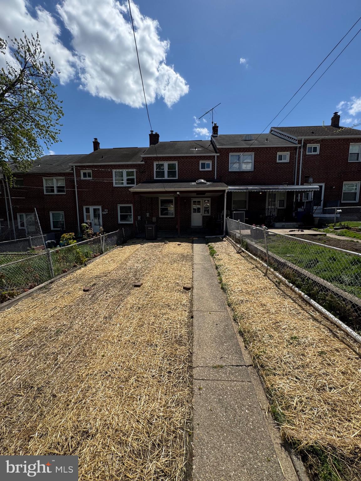 1052 Downton Road Baltimore, MD 21227 - Photo 45 of 55 a view of a house with a yard