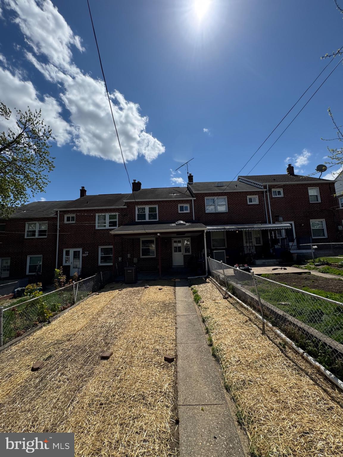 1052 Downton Road Baltimore, MD 21227 - Photo 46 of 55 a view of a house with a yard
