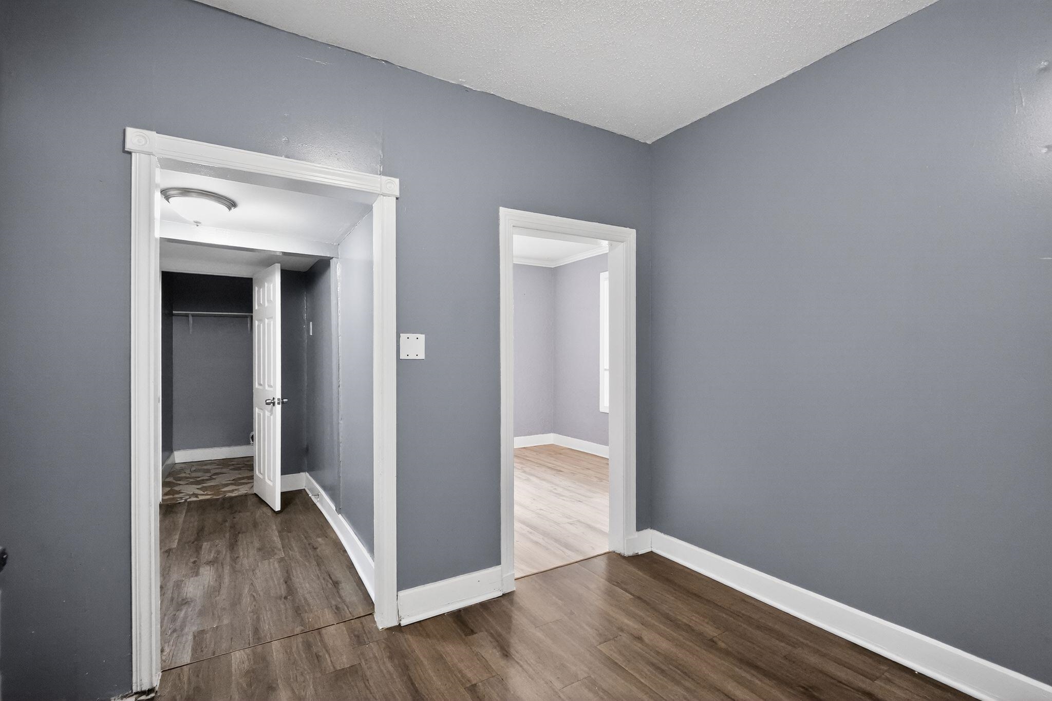 4199 Auburn Road Memphis, TN 38116 - Photo 23 of 32 Interior room with gray walls, white trim, and wood-finish flooring