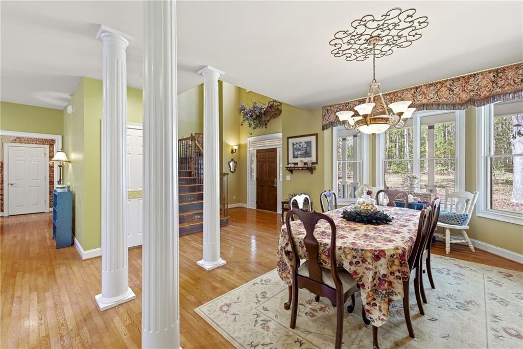 4829 Old Pendergrass Road Jefferson, GA 30549 - Photo 12 of 55 a view of a dining room with furniture window and wooden floor