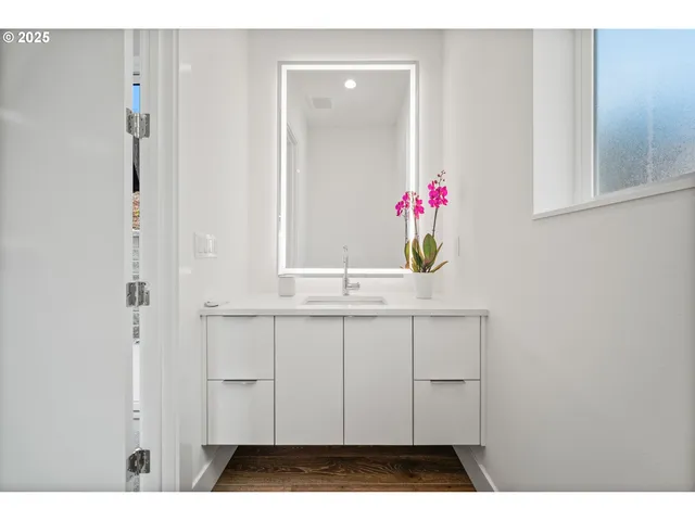 a bathroom with a sink and a mirror