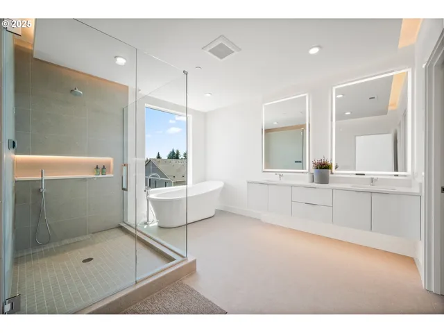 a bathroom with a shower sink and mirror