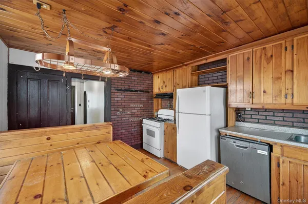 a refrigerator freezer sitting inside of a kitchen