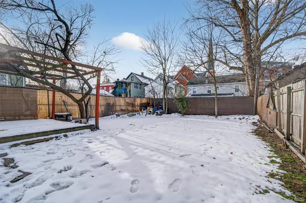 a view of backyard and tree