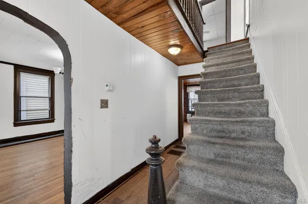 a view of entryway with a front door
