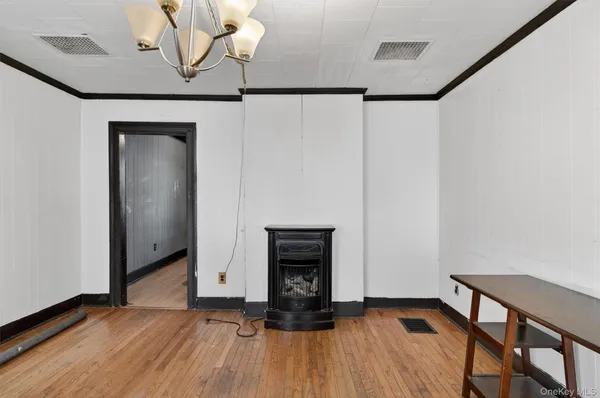 a view of a livingroom with wooden floor