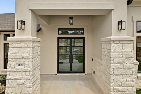 a front view of a house with large windows
