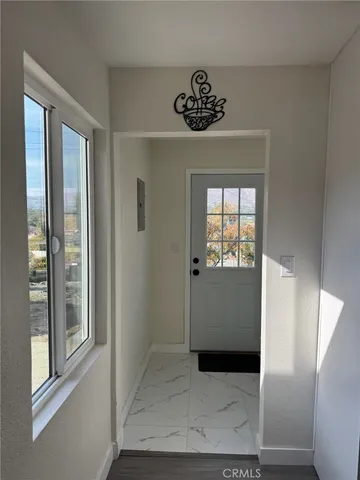 a view of a hallway with a window