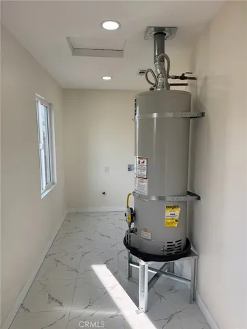 a view of a kitchen with a sink stainless steel appliances and cabinets