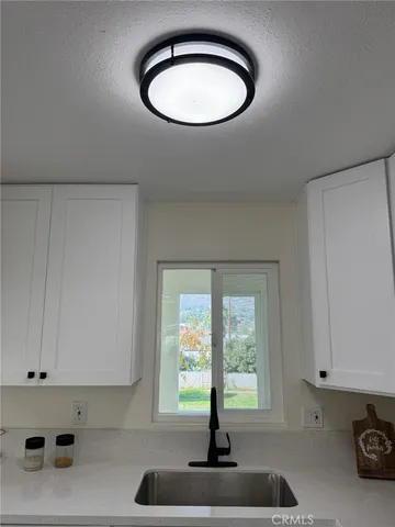 a view of entryway with kitchen