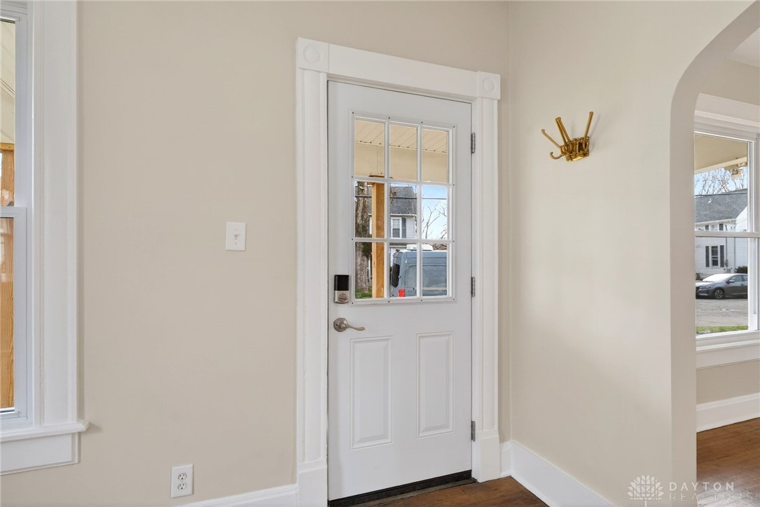 585 North Spring Street Wilmington, OH 45177 - Photo 2 of 21 This inviting entrance features a glass-paneled door, perfect for welcoming guests.