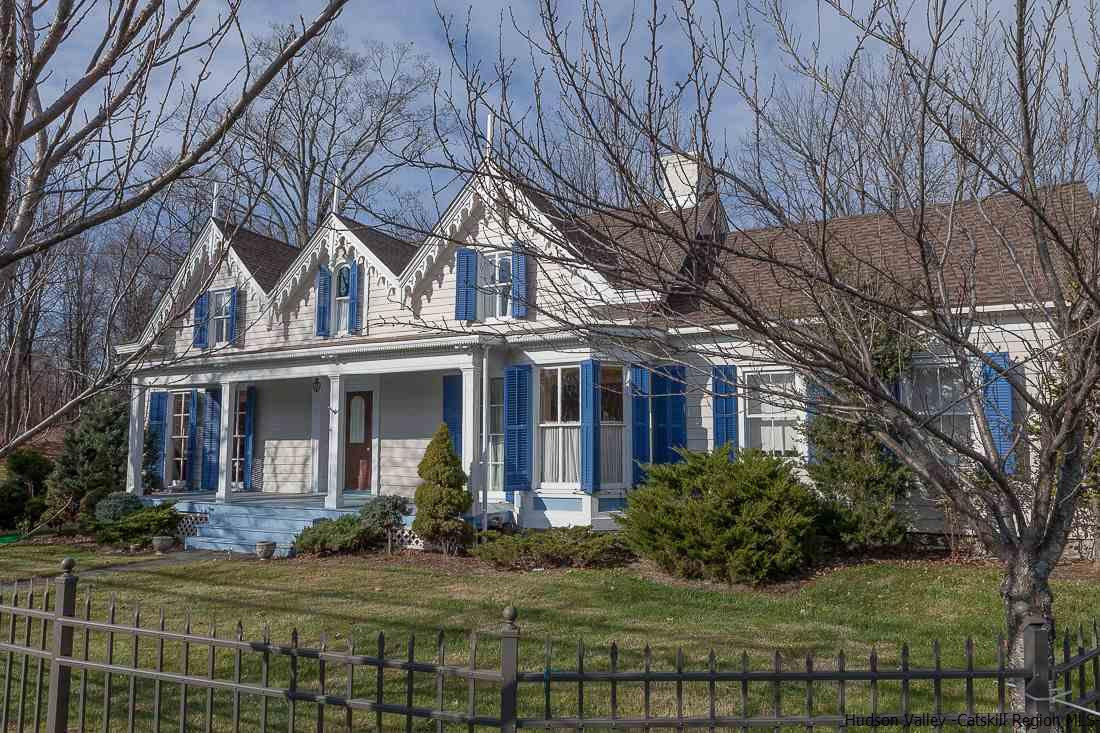 3 Mill Dam Road Stone Ridge, NY 12484 - Photo 1 of 33 a view of a white house next to a yard with big trees