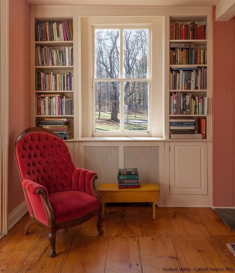 3 Mill Dam Road Stone Ridge, NY 12484 - Photo 13 of 33 a living room with furniture and a book shelf